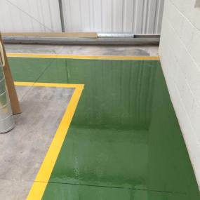 Demarcation resin floor