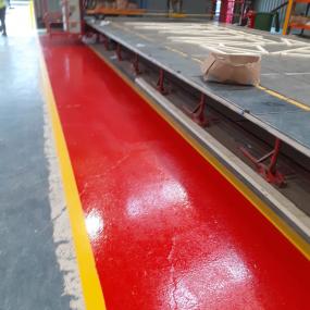 Demarcation resin floor