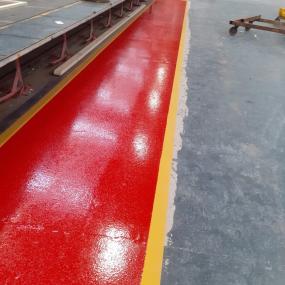 Demarcation resin floor